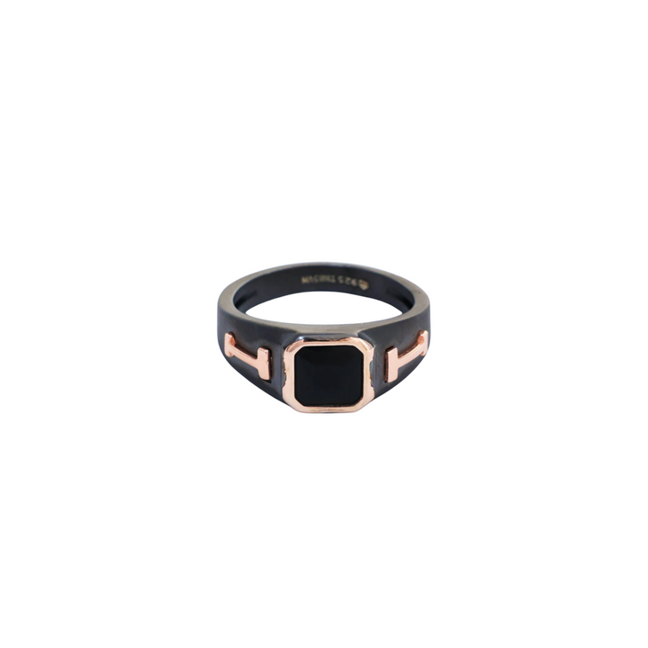 Dark matte black ring featuring a square black gem set with rose gold H-bar side motifs.