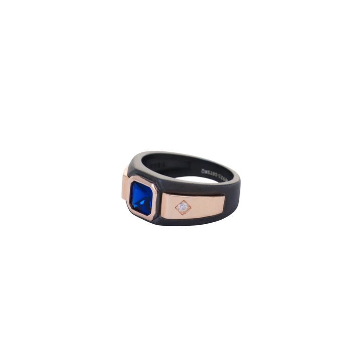 Matte black ruthenium ring holding a square blue gem between flush rose gold side plates.