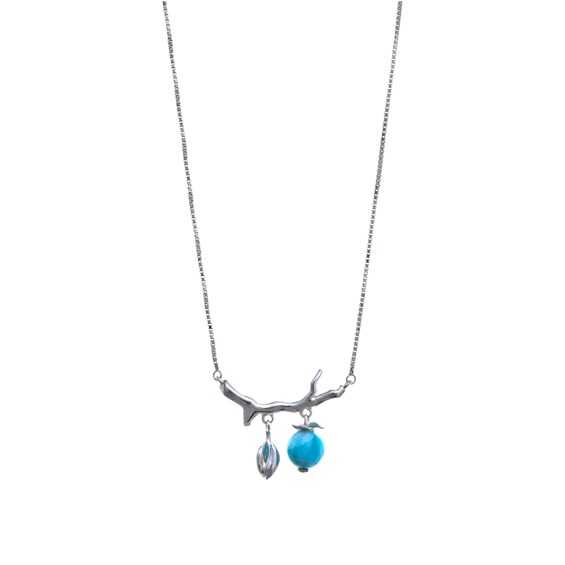 A silver-tone necklace with a horizontal tree branch pendant dangling a silver bud and a blue gemstone sphere.