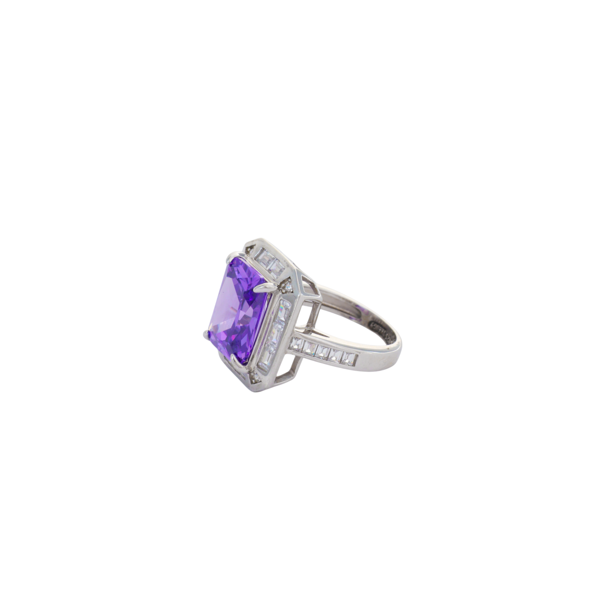 Vibrant purple emerald cut stone set within a clear baguette crystal halo in sterling silver.