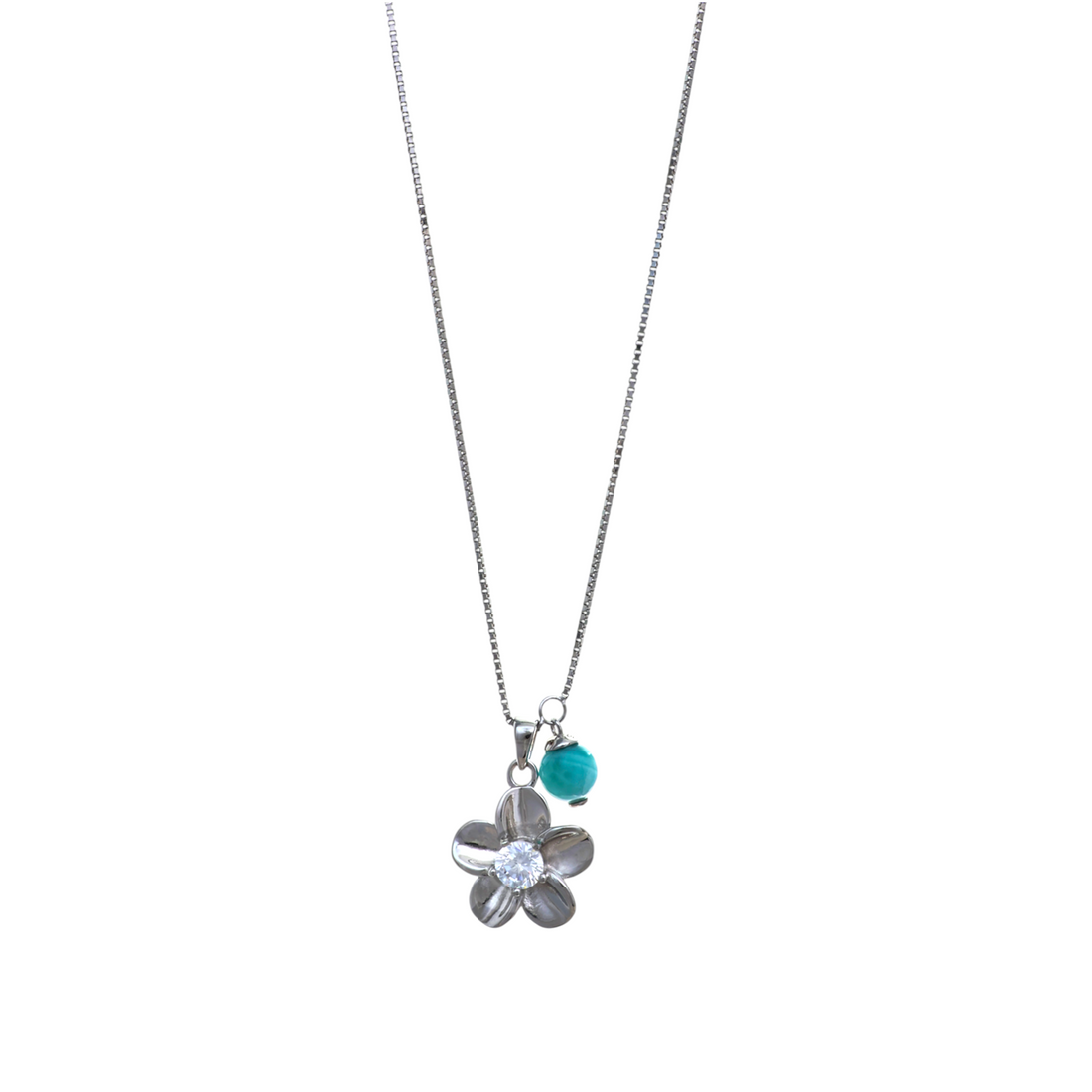 A silver-tone chain necklace with a five-petal silver flower charm set with a clear crystal and an adjacent blue bead.