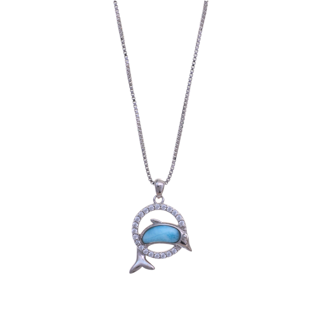 A silver-tone circular pendant encrusted with pave crystals surrounding a leaping silver dolphin inlaid with a blue stone.