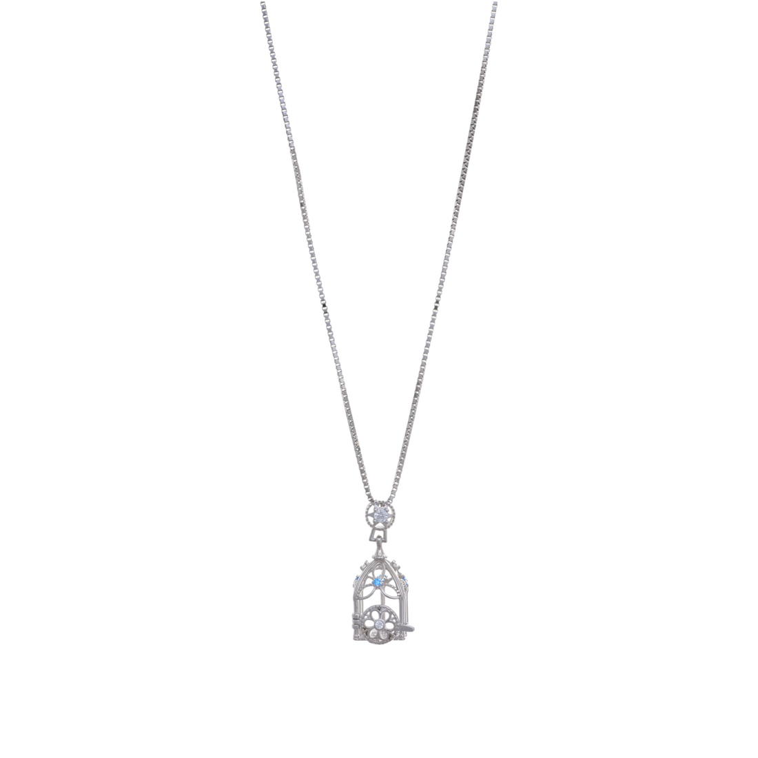A silver-tone chain necklace holding an intricate filigree birdcage pendant decorated with small blue cubic zirconia accents.
