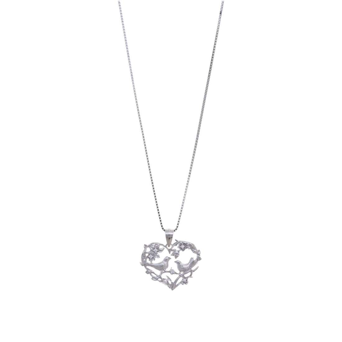 An openwork heart-shaped silver pendant formed by leafy twigs with two sweet lovebirds sitting side by side.
