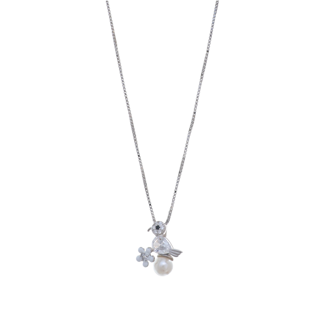 A silver-tone chain necklace with a crystal-accented bird pendant sitting atop a smooth white pearl drop beside a flower charm.