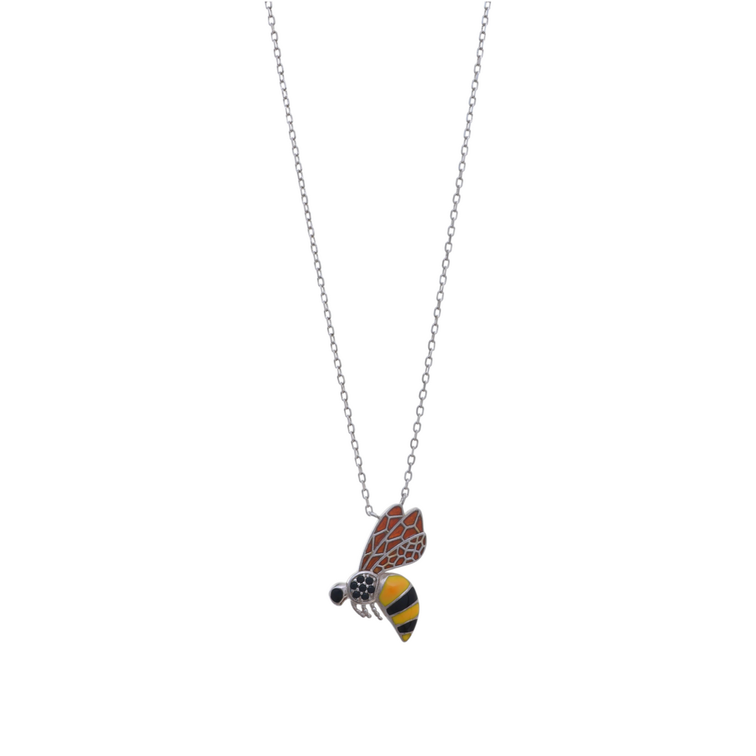 A silver chain necklace featuring a flying honeybee pendant detailed with yellow and orange enamel and dark crystals.