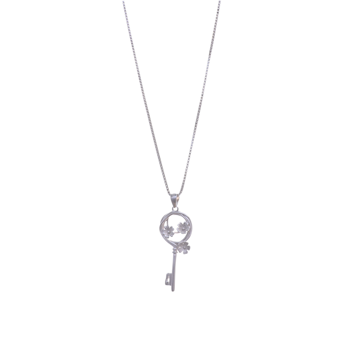 A silver chain necklace featuring a key pendant detailed with delicate carved flower blossoms inside a circular frame.