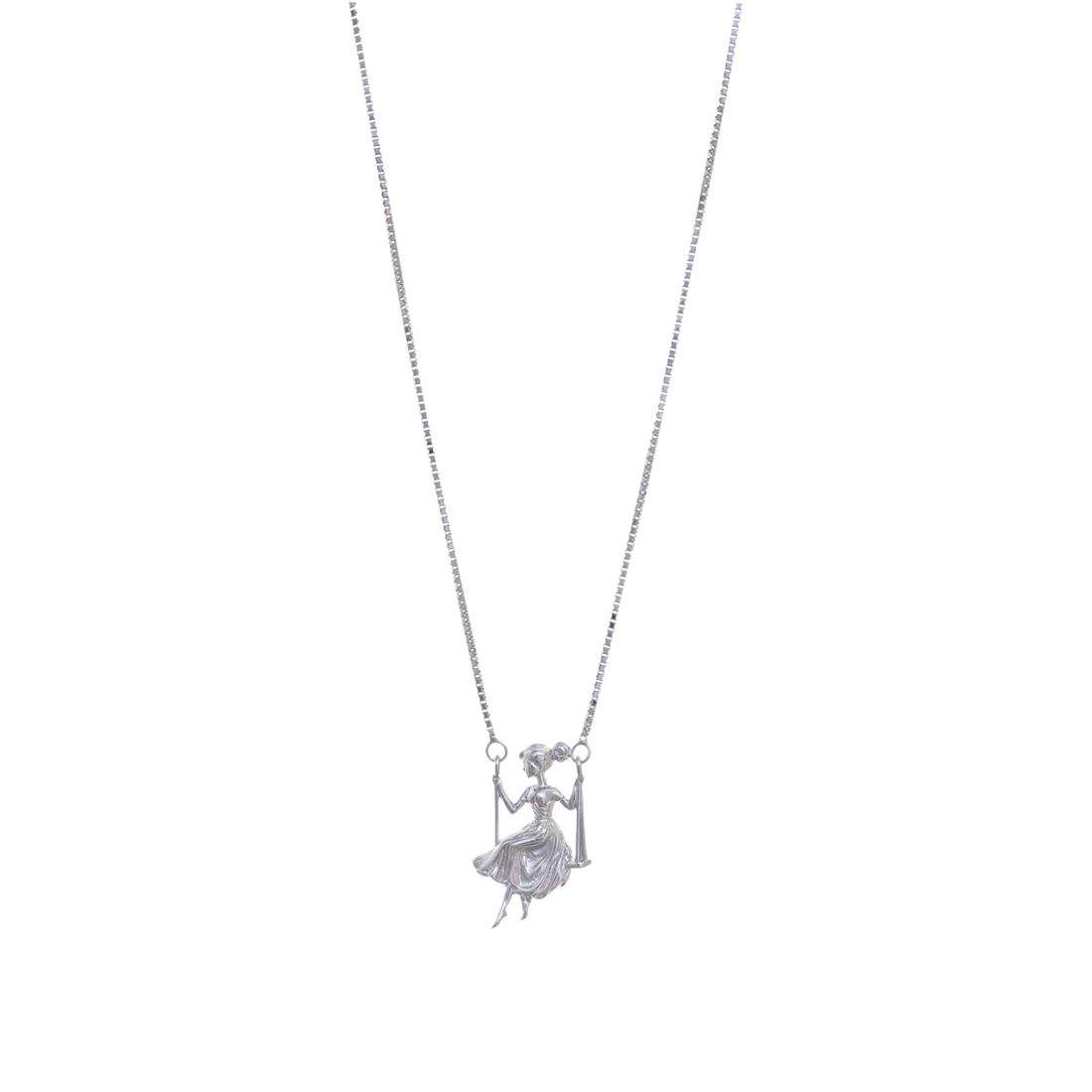 A silver necklace featuring a double-attached pendant depicting a girl gracefully seated on a swing.
