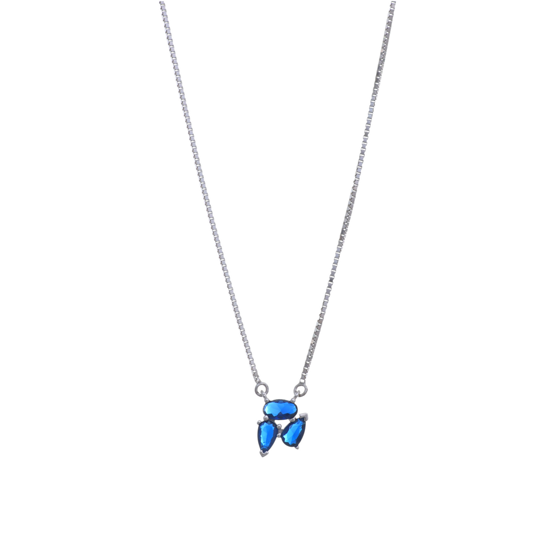 A silver chain holding a pendant crafted from a cluster of vibrant blue oval and teardrop cut gemstones.