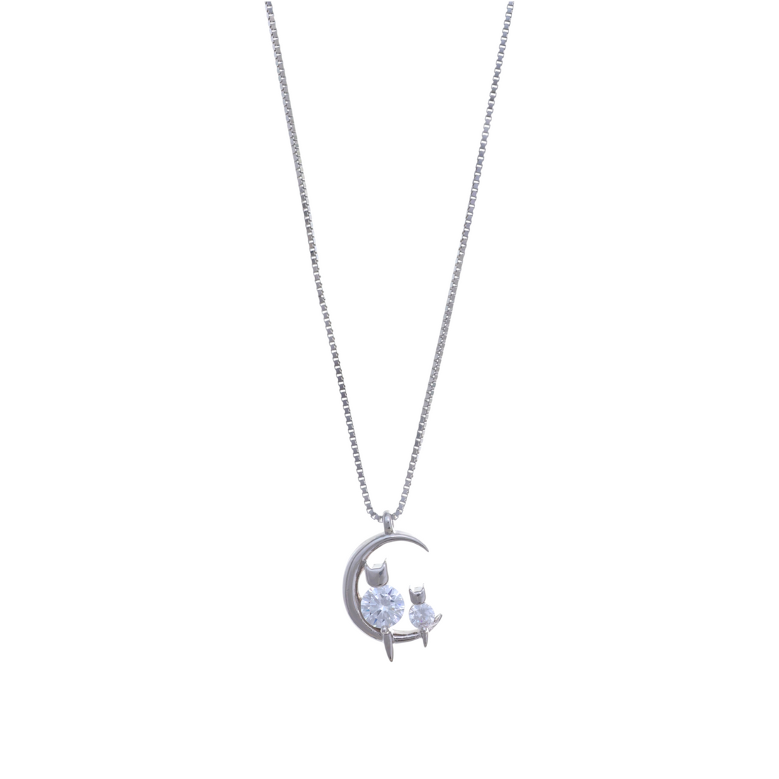 A silver chain necklace with a crescent moon pendant featuring two small cats set with clear round crystals.