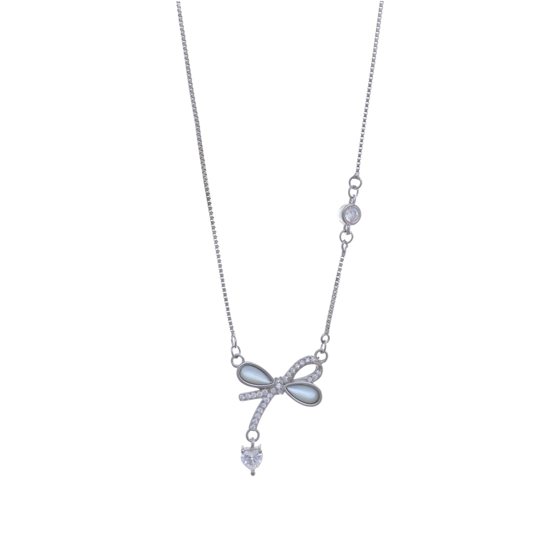 Silver chain necklace with a mother-of-pearl ribbon bow pendant and dangling heart CZ charm.